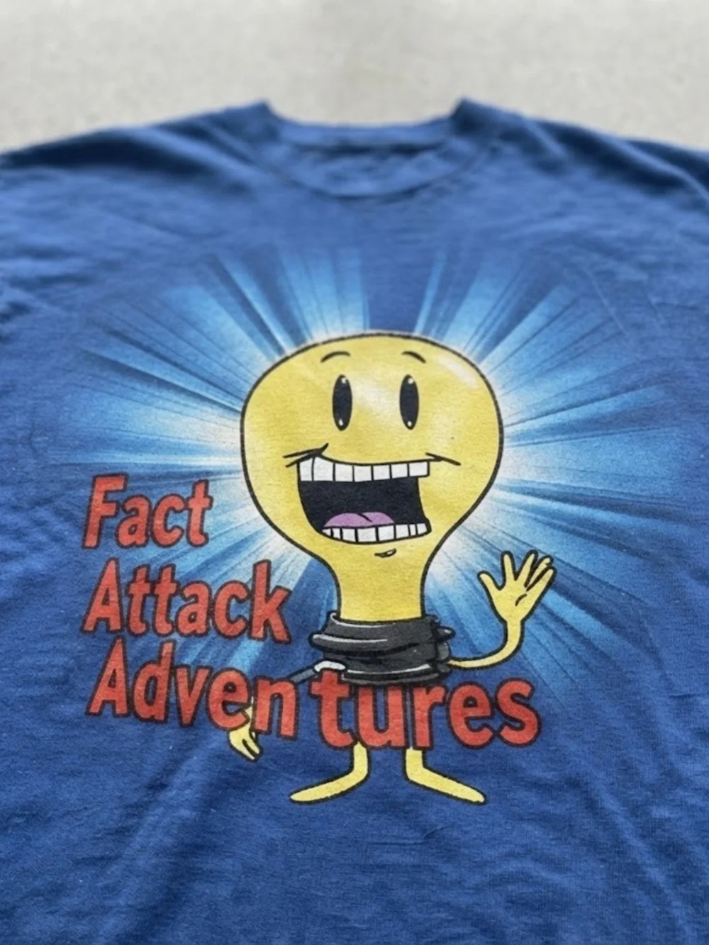 Fact Attack Adventures Cartoon Lightbulb Blue Gildan T-Shirt